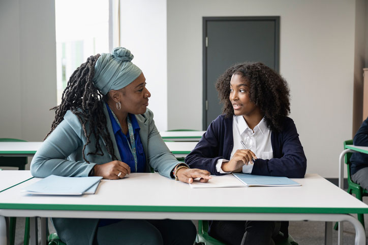 student talking with school counselor